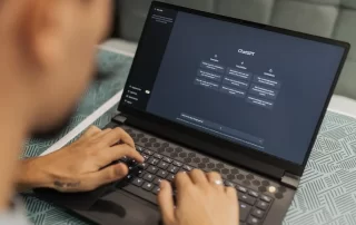 person using ChatGPT on laptop