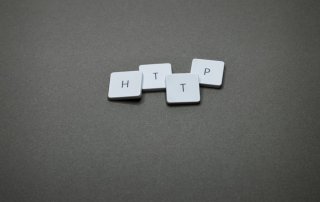 HTTP spelled out with white tiles on grey background