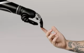 traditional SEO and AI concept image - robotic hand and human hand touching fingertips