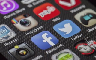 up-close view of social media app icons on smartphone