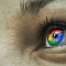 Google logo reflected in person’s eyes
