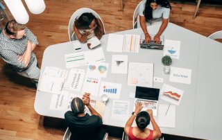 marketing team working around large table