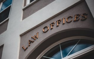 law offices sign over arched window