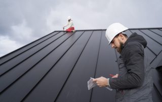 roofers completing new roof installation